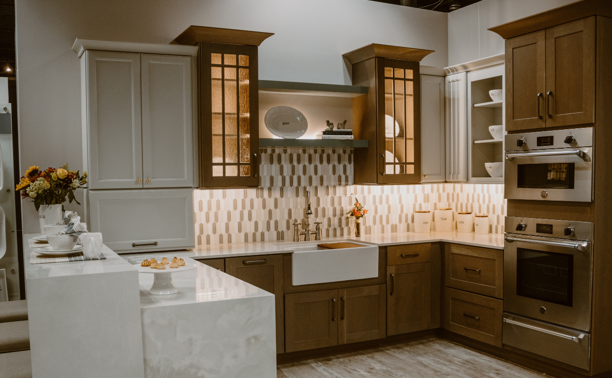 brown and white tile backsplash in a kitchen with brown and black cabinetry