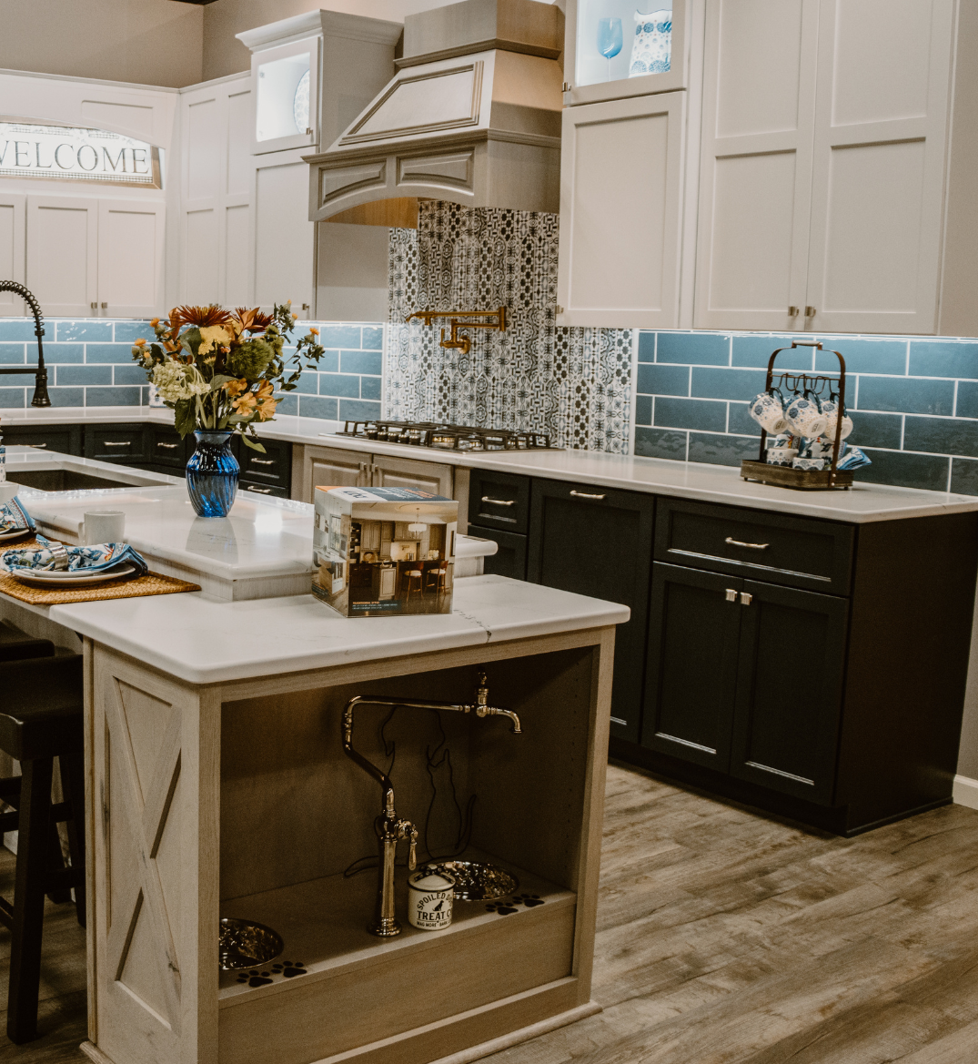 White kitchen countertops on black and white cabinets